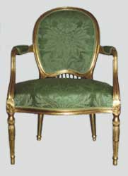 The chair gilded and upholstered